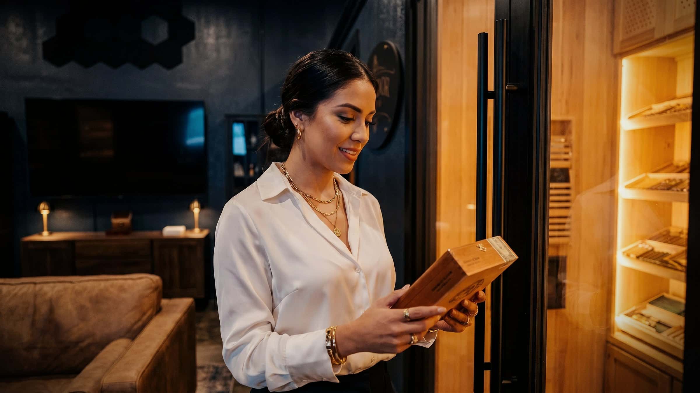 Guest selecting a cigar with guidance inside Humidor On Austin